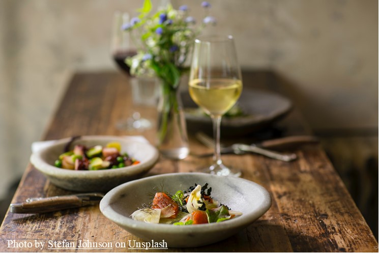 Photo of a meal and wine glass